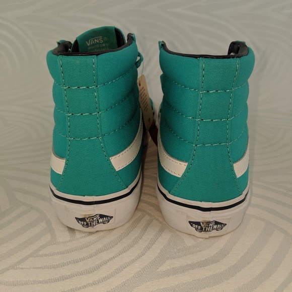 teal green vans